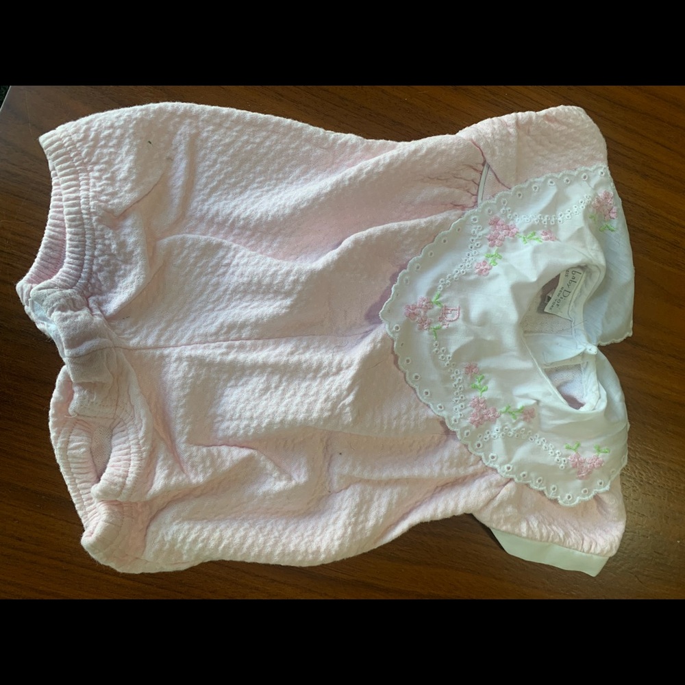 Never worn Baby Dior onesie